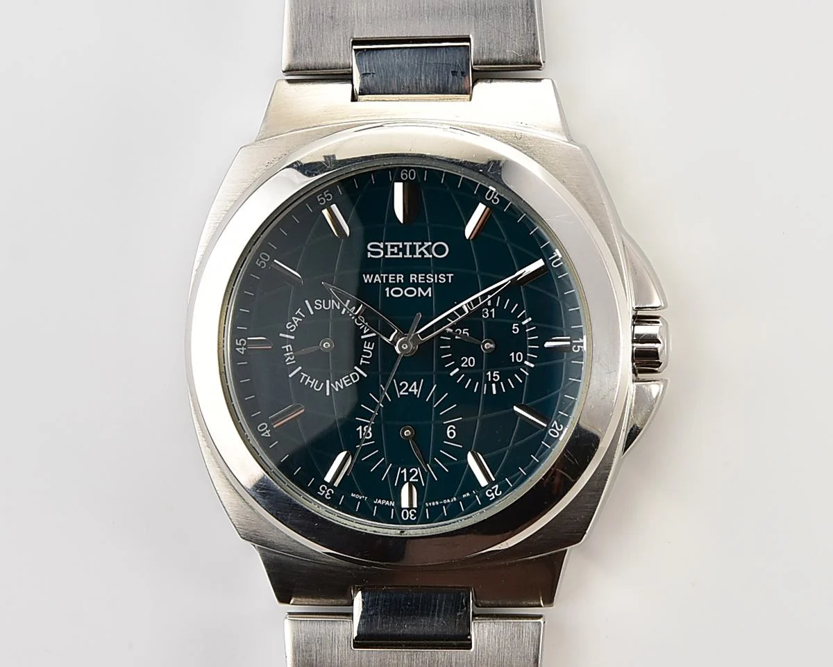 Vintage Seiko Multi-Calendar Quartz Watch with Deep Teal Globe Dial