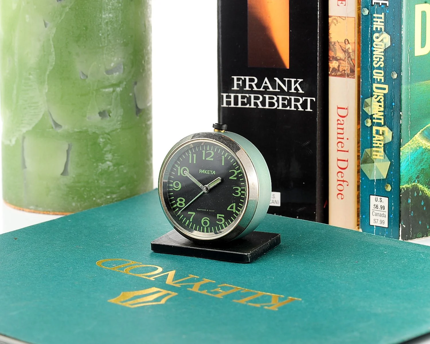 Small Raketa Soviet mechanical alarm clock - less than 2 inches in diameter