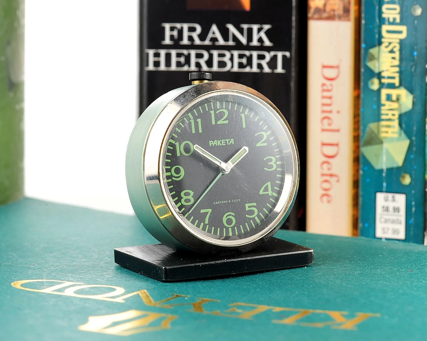 Small Raketa Soviet mechanical alarm clock - less than 2 inches in diameter