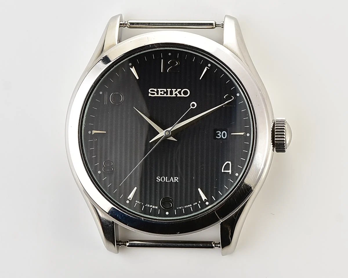 Sleek Sustainability: Seiko Solar Dress Watch with stark black textured dial