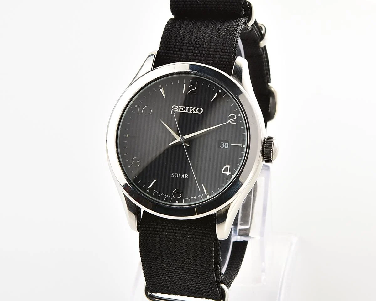 Sleek Sustainability: Seiko Solar Dress Watch with stark black textured dial