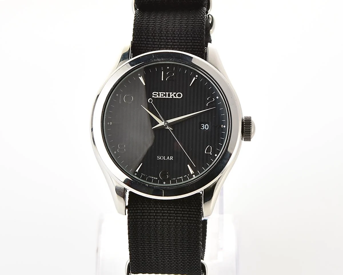 Sleek Sustainability: Seiko Solar Dress Watch with stark black textured dial