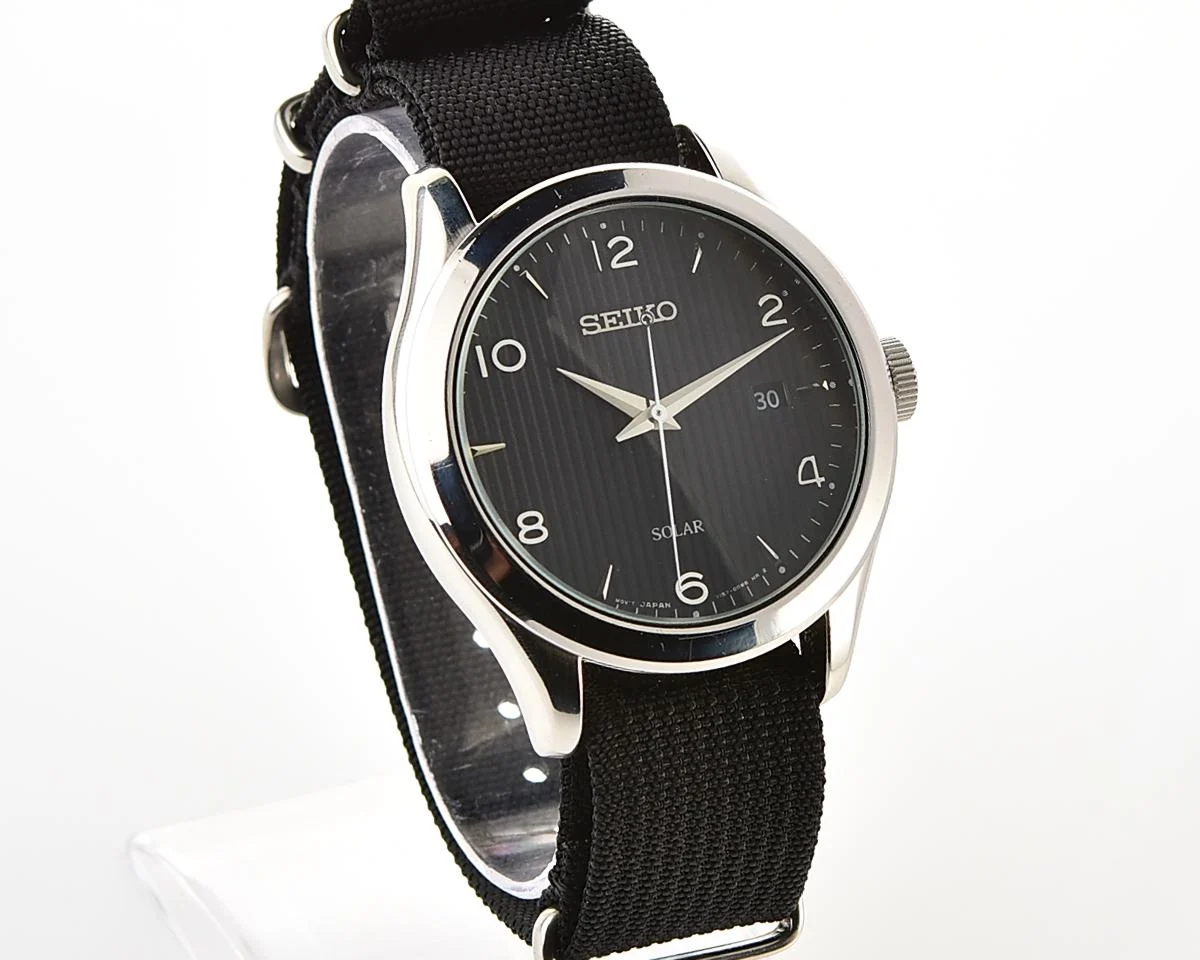 Sleek Sustainability: Seiko Solar Dress Watch with stark black textured dial
