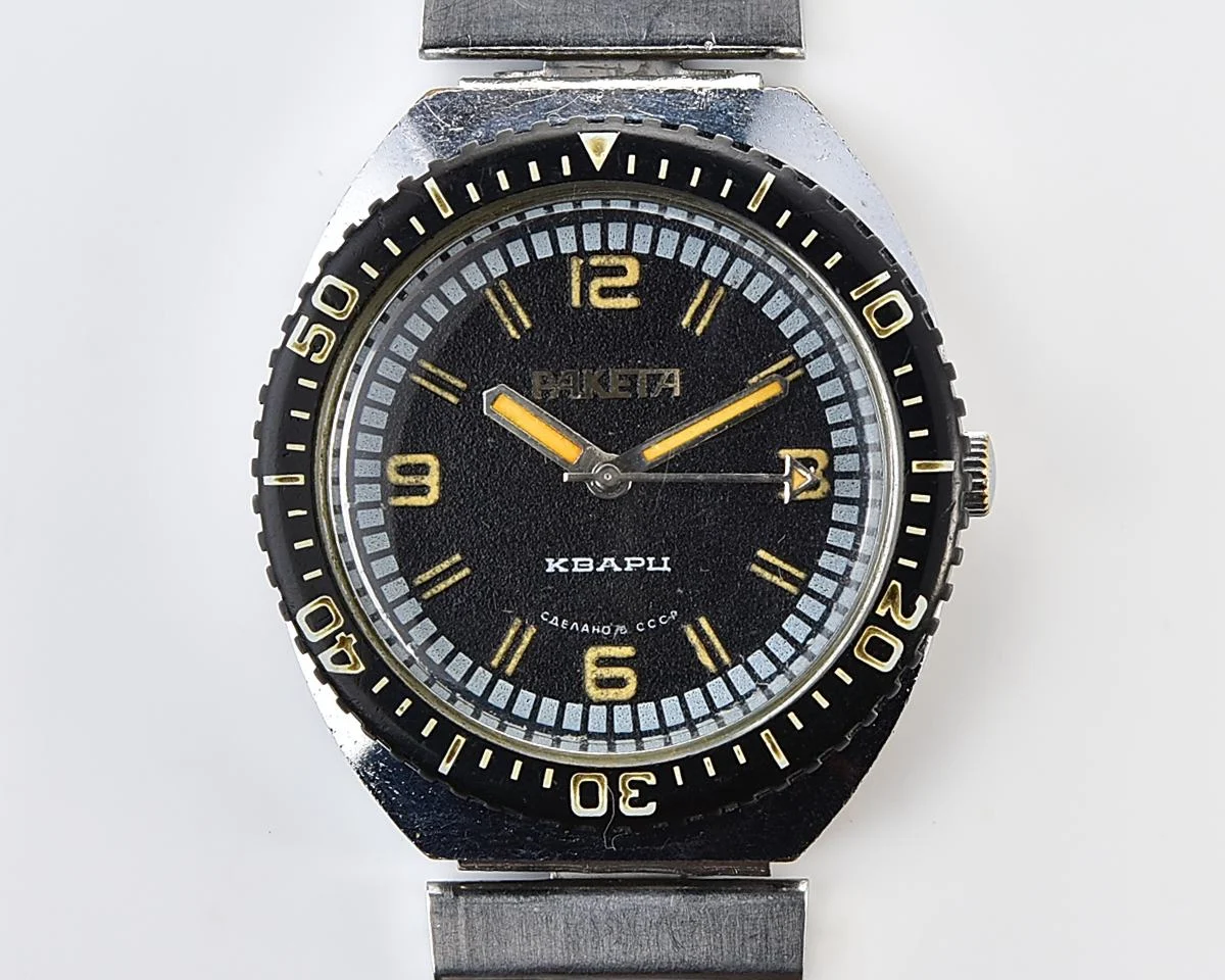 Vintage Soviet Raketa quartz watch with rotating bezel