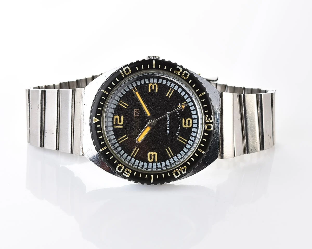 Vintage Soviet Raketa quartz watch with rotating bezel