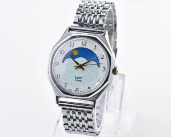 Luch quartz watch with moving Sun/Moon across the dial