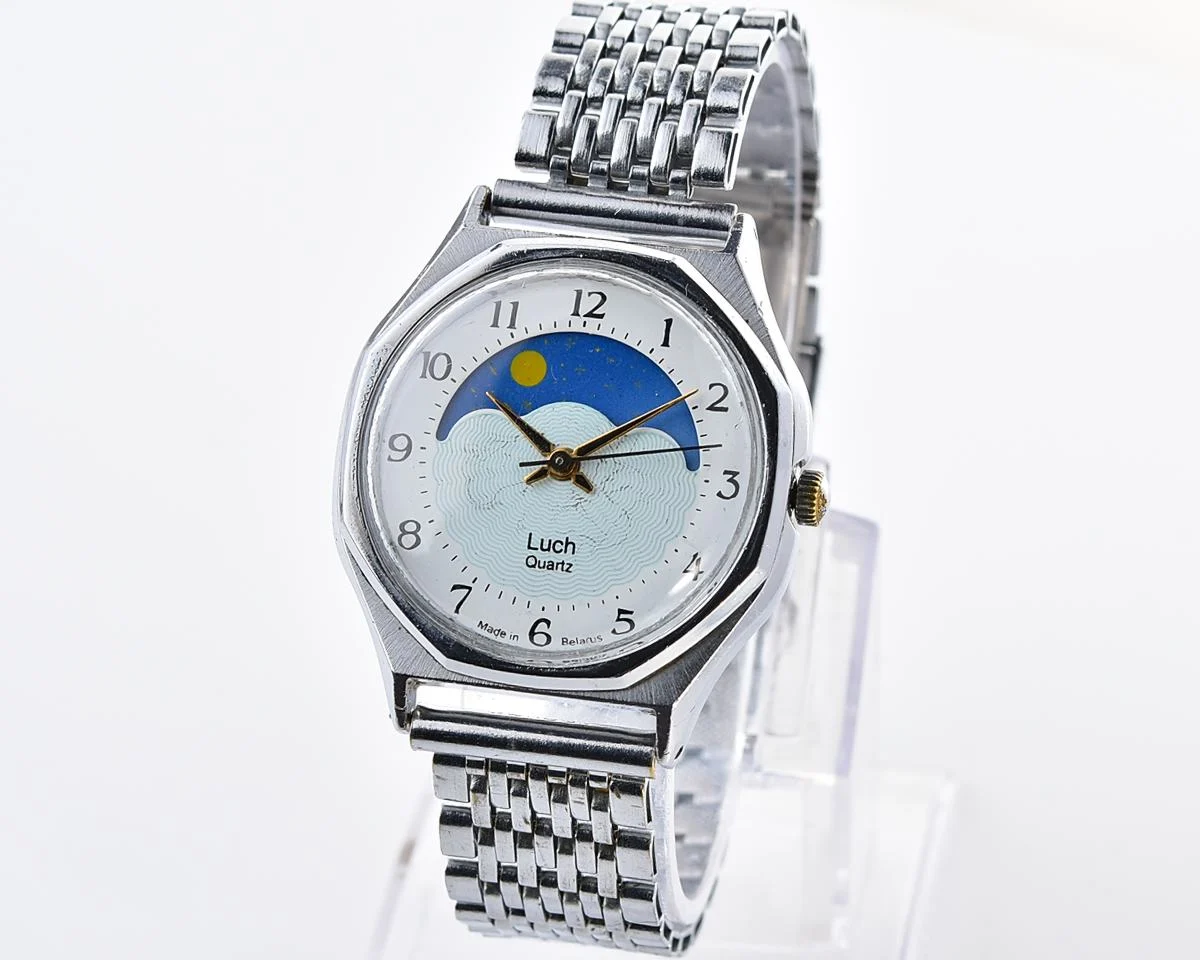 Luch quartz watch with moving Sun/Moon across the dial