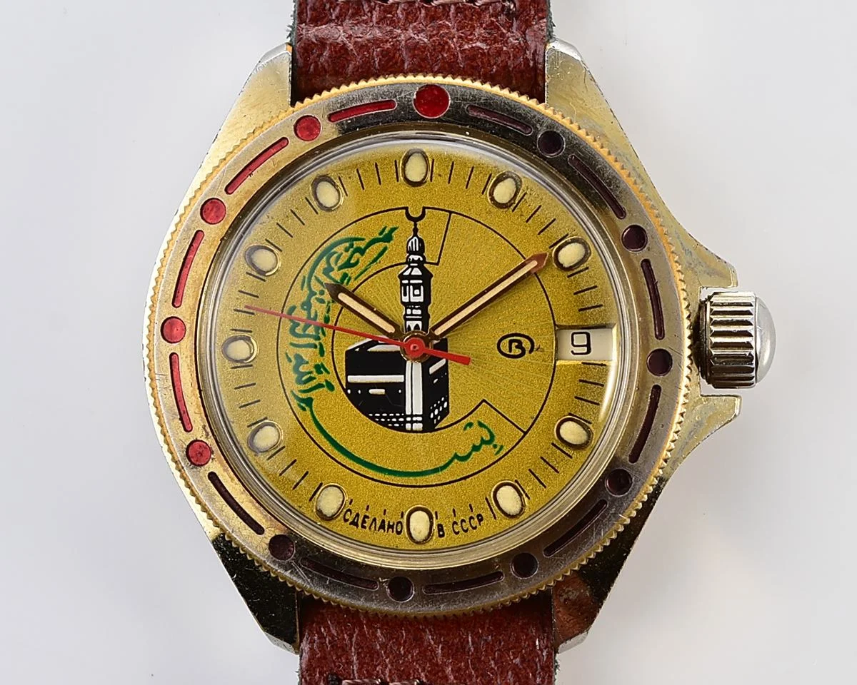 Soviet Komandirskie vintage mechanical wristwatch with Kaaba & minaret on it's gold-toned sunburst dial