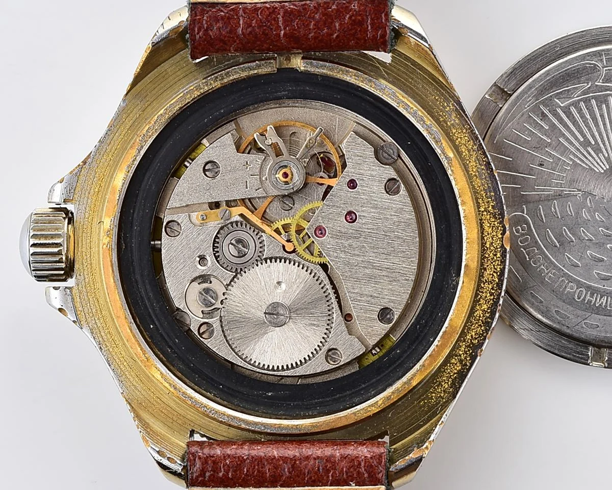 Soviet Komandirskie vintage mechanical wristwatch with Kaaba & minaret on it's gold-toned sunburst dial