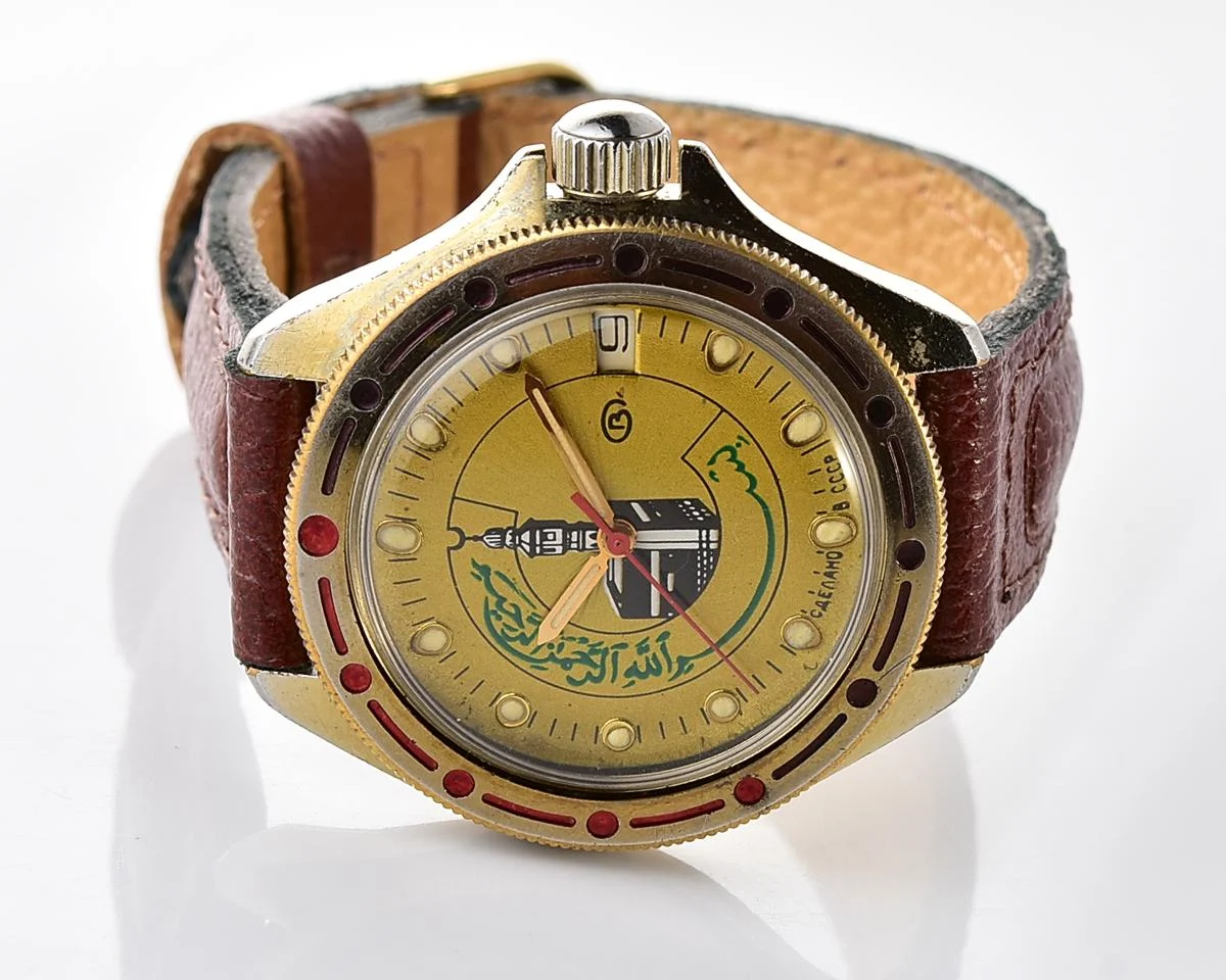 Soviet Komandirskie vintage mechanical wristwatch with Kaaba & minaret on it's gold-toned sunburst dial