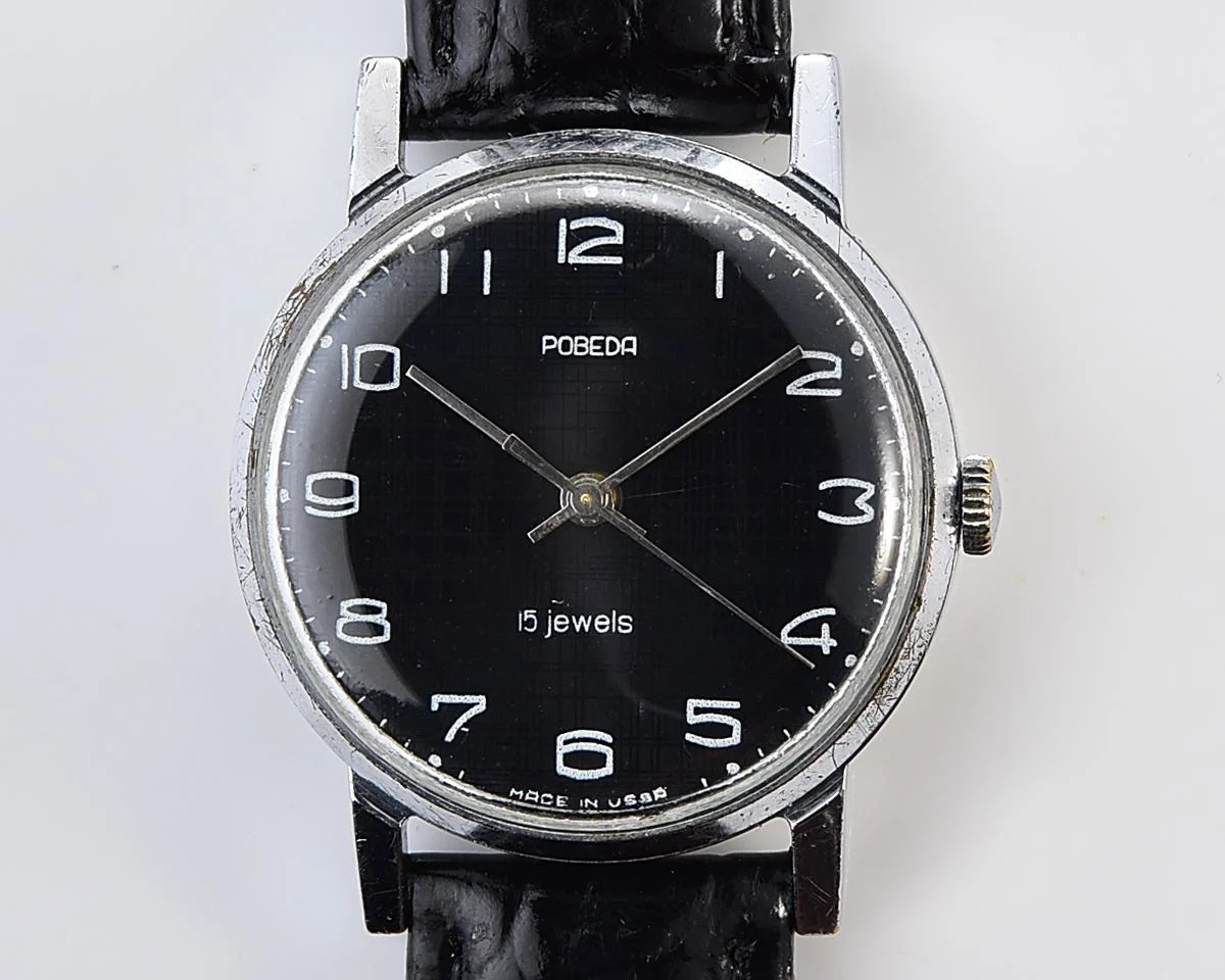 Vintage Soviet mechanical watch Pobeda, ZiM factory – black "linen" dial