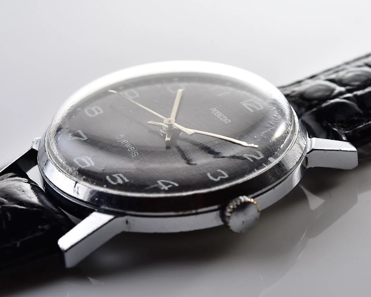Vintage Soviet mechanical watch Pobeda, ZiM factory – black "linen" dial