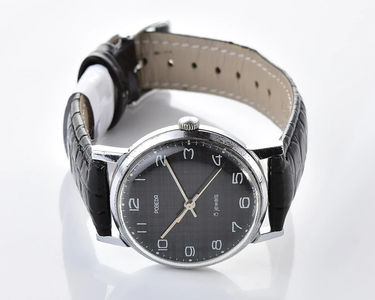 Vintage Soviet mechanical watch Pobeda, ZiM factory – black "linen" dial