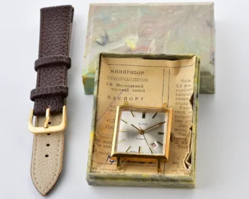 Square Slava Soviet gold-plated mechanical watch with date - complete with box & passport, from January 1976