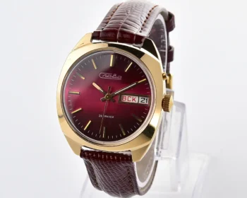 Cushion-case Slava Soviet gold-plated mechanical watch with burgundy dial, day & date, 26 jewels – with box, presented by the Kiev Military District command in December 1981