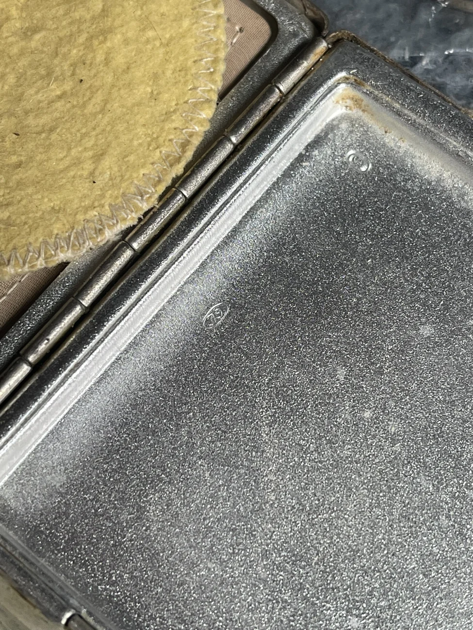 Stamped marks inside the Soviet Leningrad powder compact